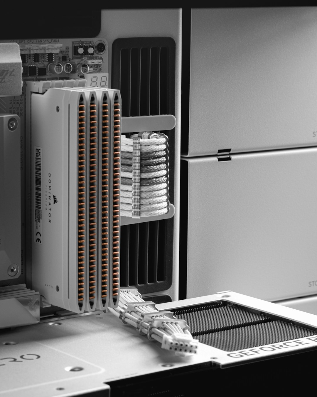 Storage components and cabling inside a white chassis