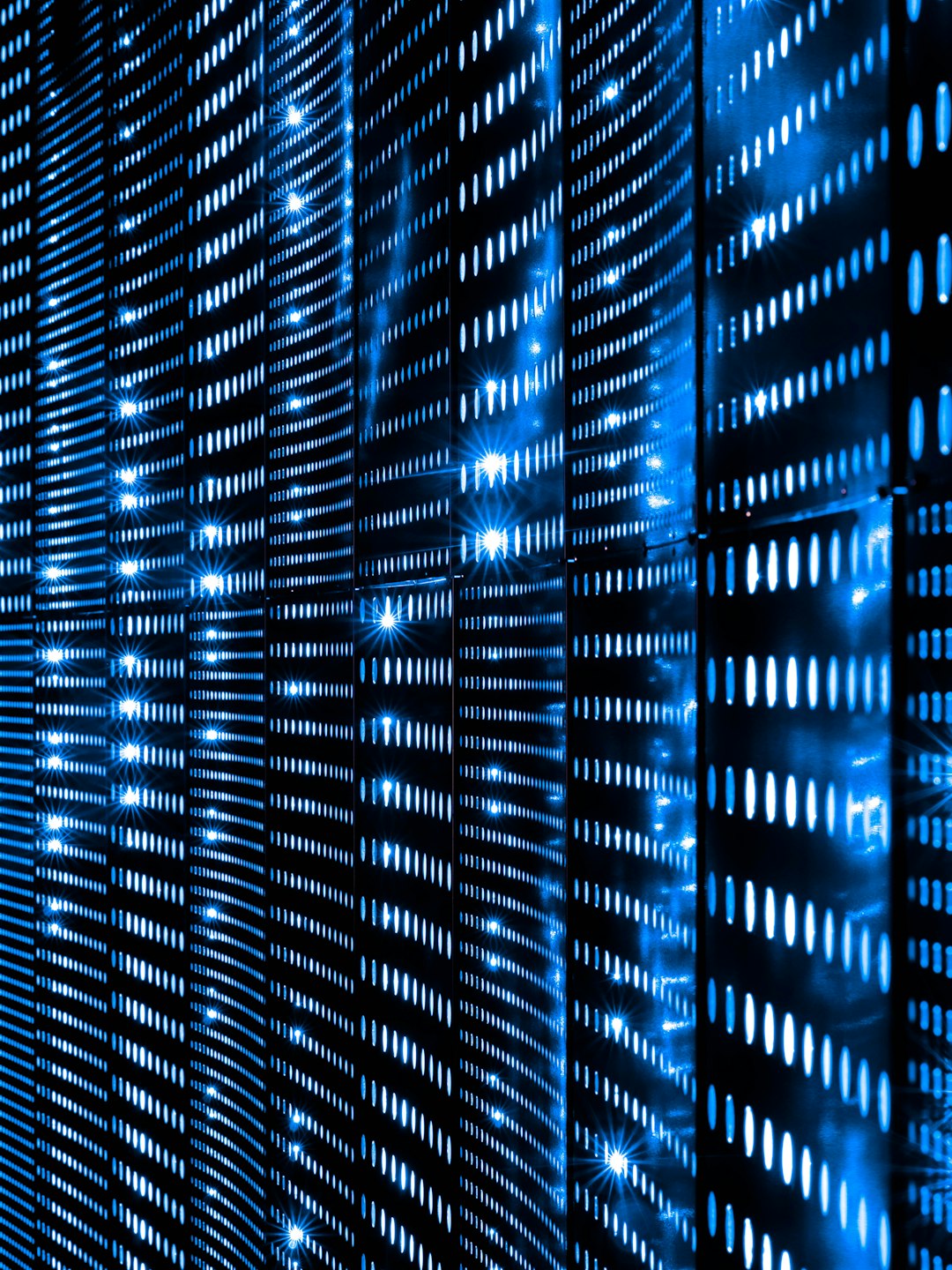 Wall of blue server status lights in a data centre