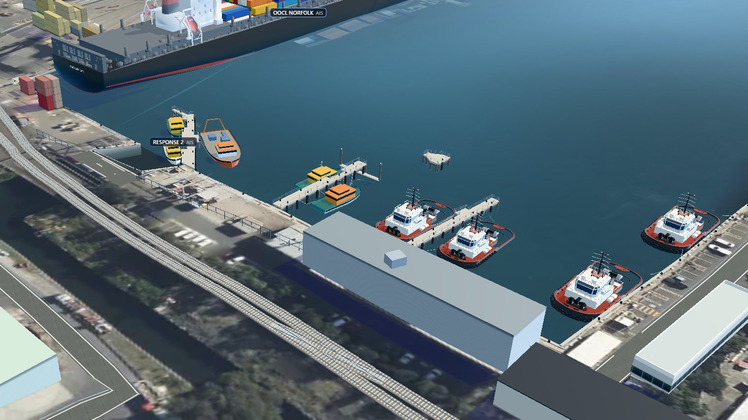 The tug harbour at Port Botany after the redraw: water at sea level, vertical quay walls traced from the aerial photo, and tugs and pilot boats afloat at their piers.